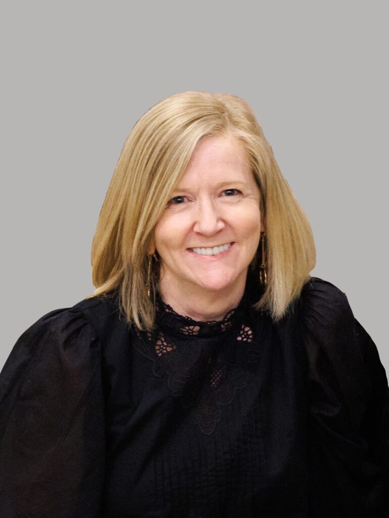 Clinical Psychologist Kate Mathew headshot with blond bob wearing black shirt against grey backdrop